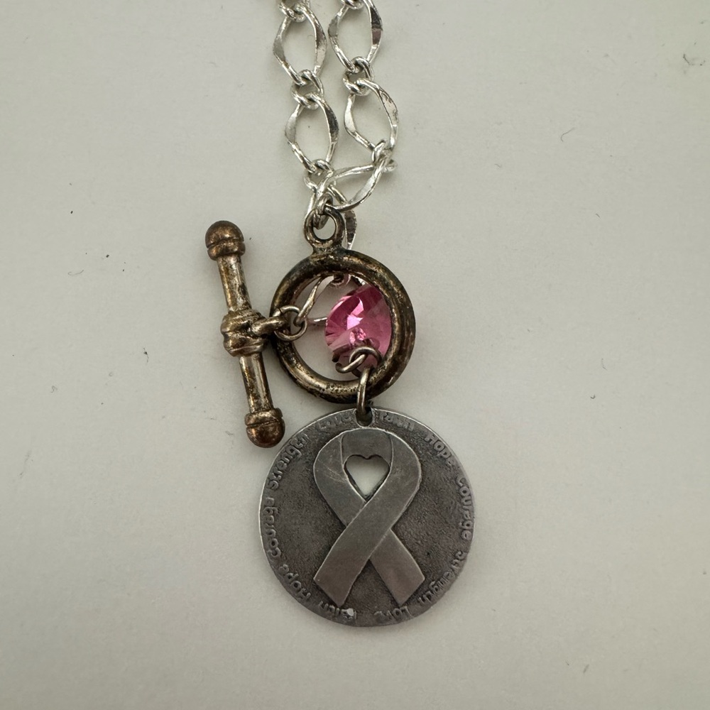 Chic Silver Necklace with Pink Gemstone and Ribbon Pendant
